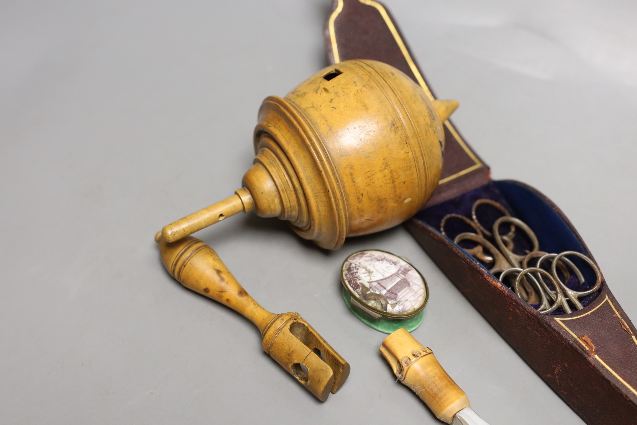 A boxwood spinning top, cased set of scissors, oval patch box and boxed Asprey